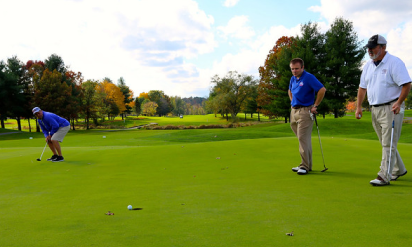 Golf player hoping to make the put and win the golf game bet