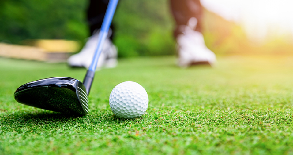  Low angle of Golf Club hitting the golf ball