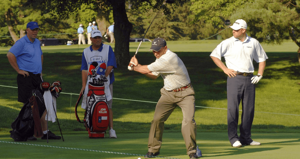 Three golfers on the green