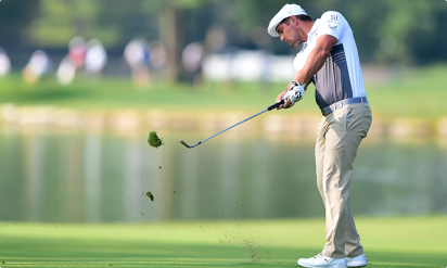 Golfer playing his shout low angle